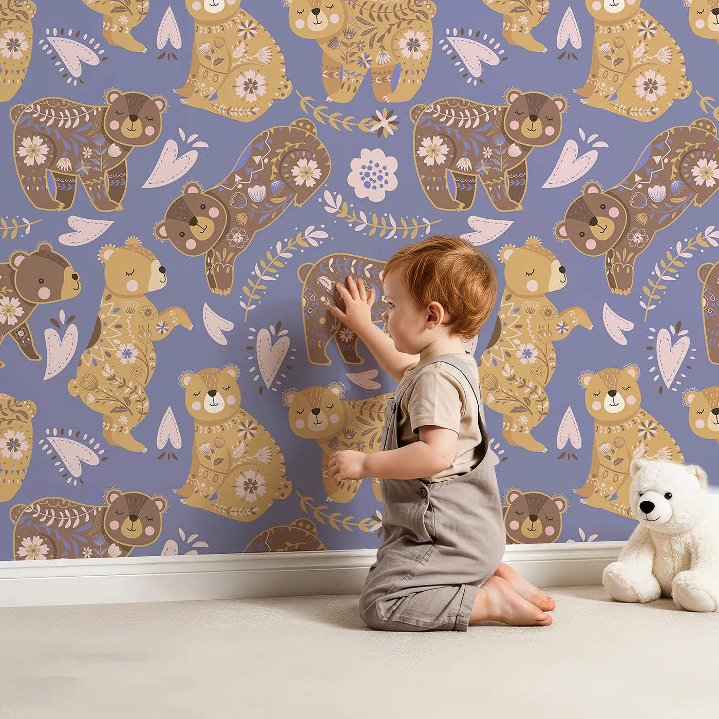 Lovely child standing in front of Whimsy Tots Floral Snuggle Bears Wallpaper in Dusty Purple with bear, flower, heart, leaf in design.