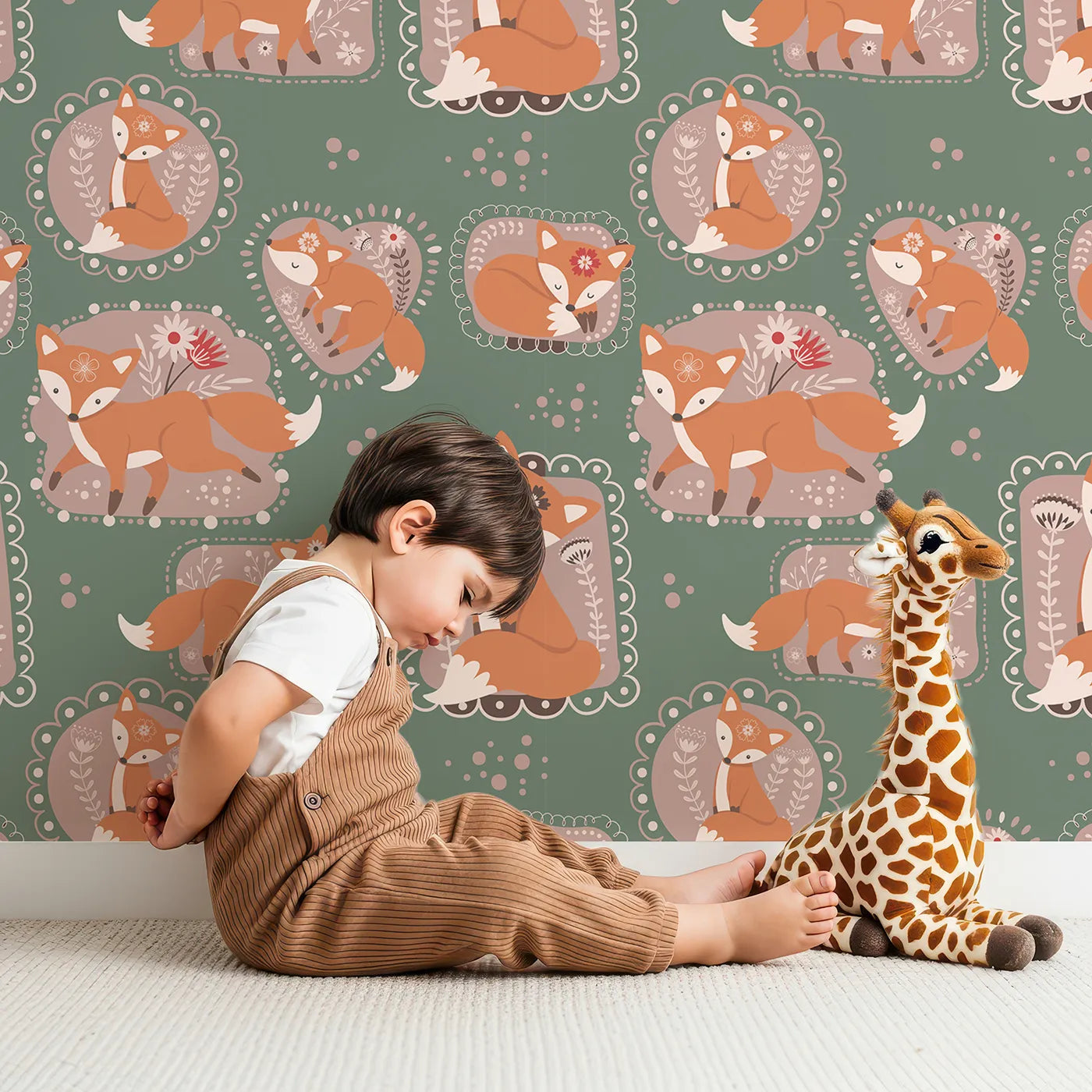 Lovely child standing in front of Whimsy Tots Fox Meadow Moments Wallpaper in Forest Green with fox, flower, frame in design.