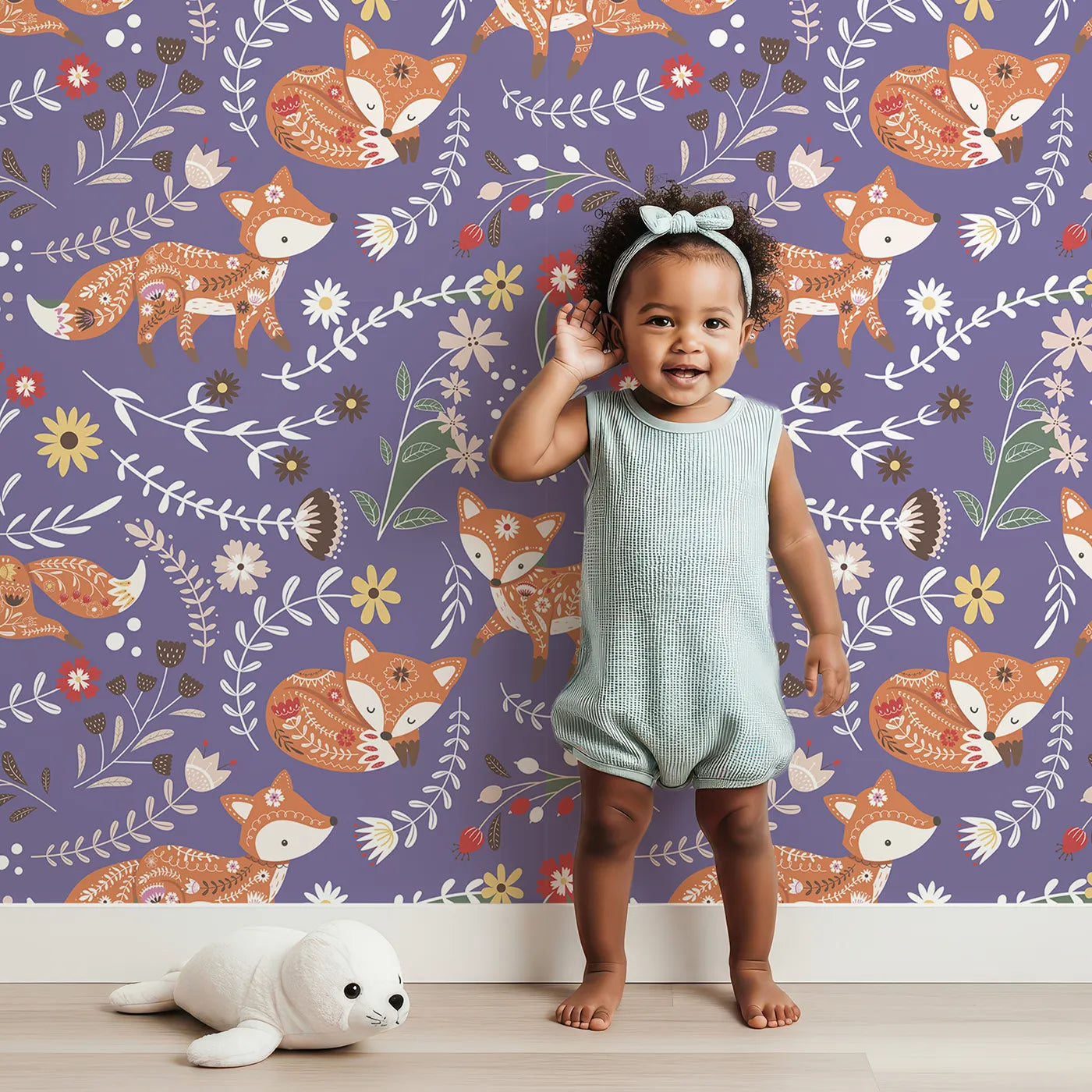 Lovely child standing in front of Whimsy Tots Folk Bloom Foxes Wallpaper in Wild Violet with fox, flower, vine in design.