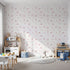 Front view of Whimsy Tots' Dino Fossil Footprints Wallpaper in Dusty Pink