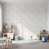 Front view of Whimsy Tots' Dino Fossil Footprints Wallpaper in Warm Sand