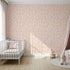 Front view of Whimsy Tots' Floral Feather Drift Wallpaper in Blush Bloom Pink