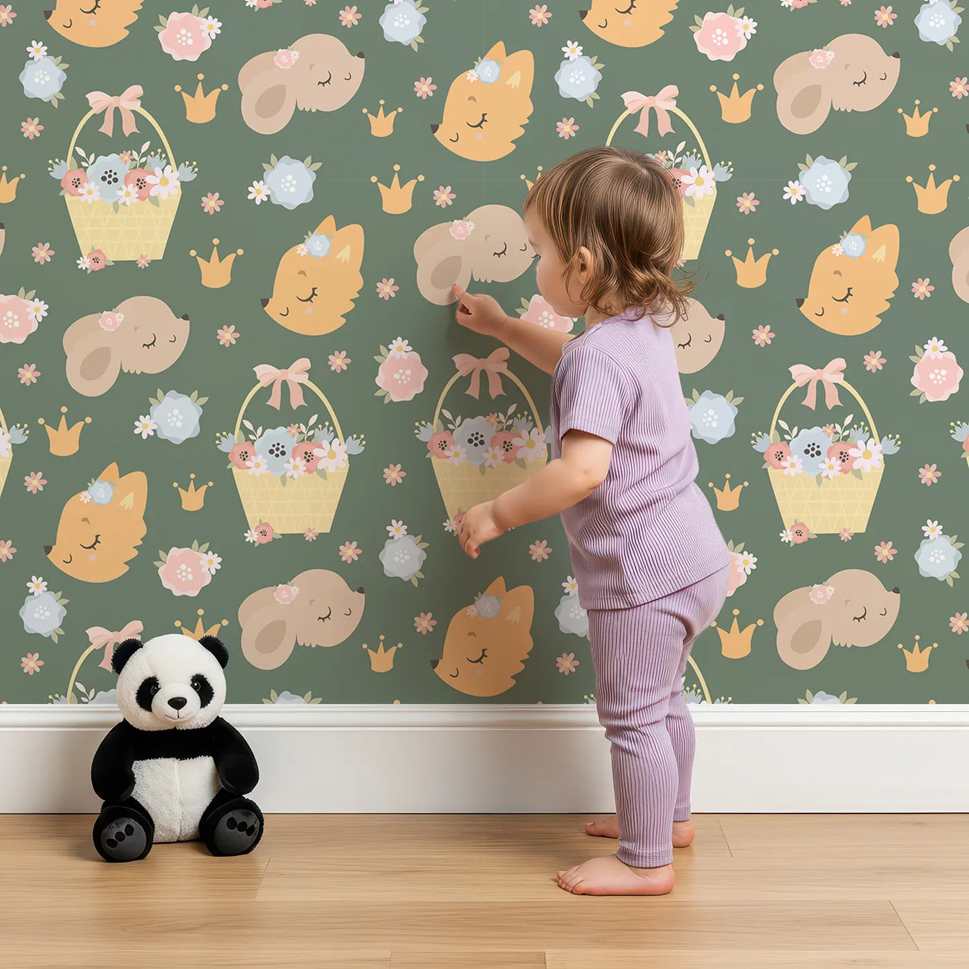 Lovely child standing in front of Whimsy Tots Blossom Basket Friends Wallpaper in Forest Meadow Green with fox, mouse, flower, basket, crown in design.