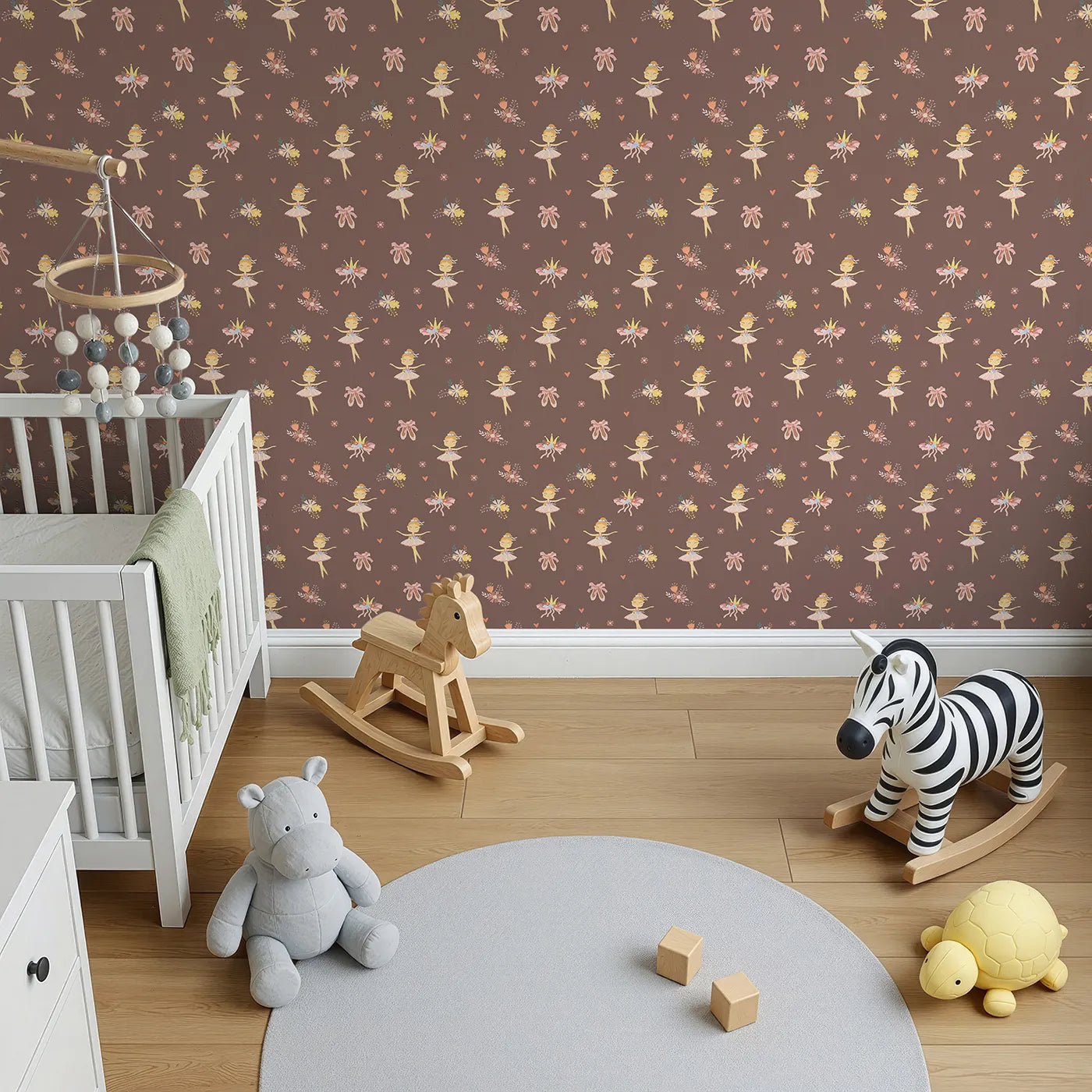 Top-Down view of Whimsy Tots' Blush Ballerina Dreams Wallpaper Pink (W3124A).Graceful ballerinas and crowns float across a cocoa-blush sky.