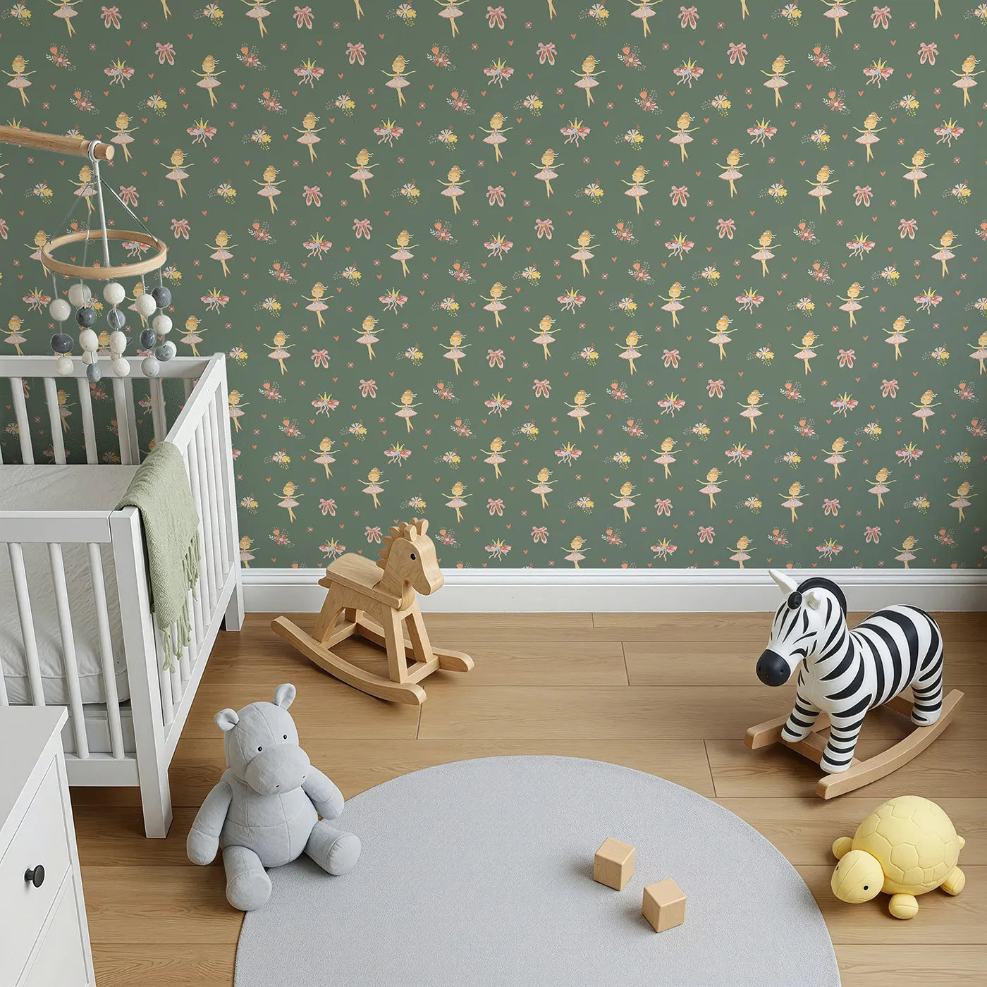 Top-Down view of Whimsy Tots' Blush Ballerina Dreams Wallpaper in Forest Waltz Green (W3124B).Tutus and crowns pirouette across a soft mossy green scene.