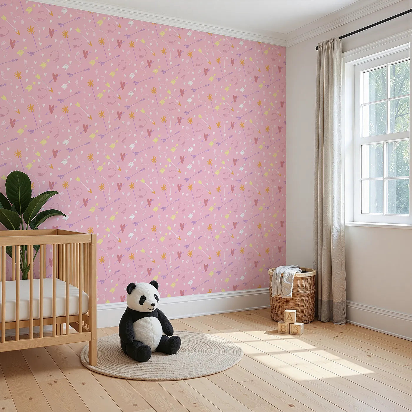 Angled view of Whimsy Tots' Cupids Arrow Parade Wallpaper in Blush Pink (W3143A).Hearts and arrows dance across a candy-sweet pink sky.