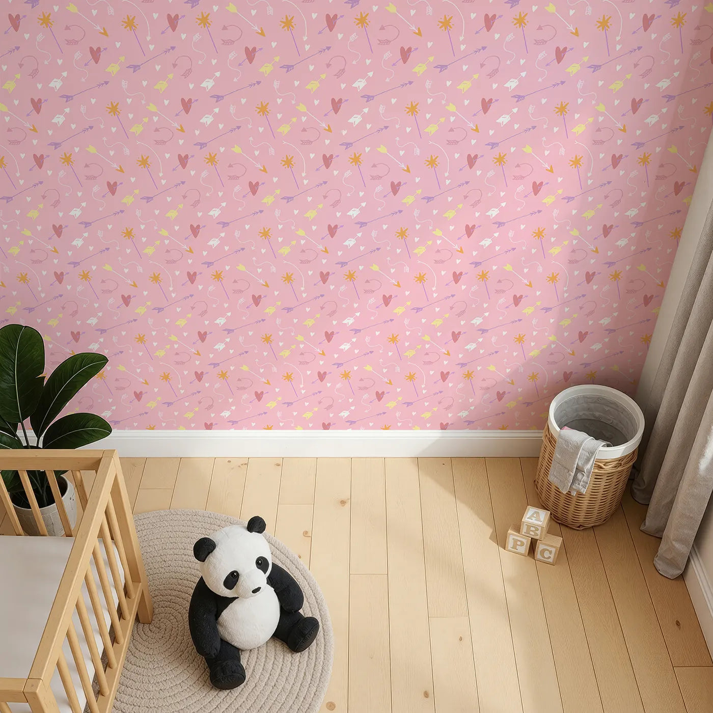 Top-Down view of Whimsy Tots' Cupids Arrow Parade Wallpaper in Blush Pink (W3143A).Hearts and arrows dance across a candy-sweet pink sky.