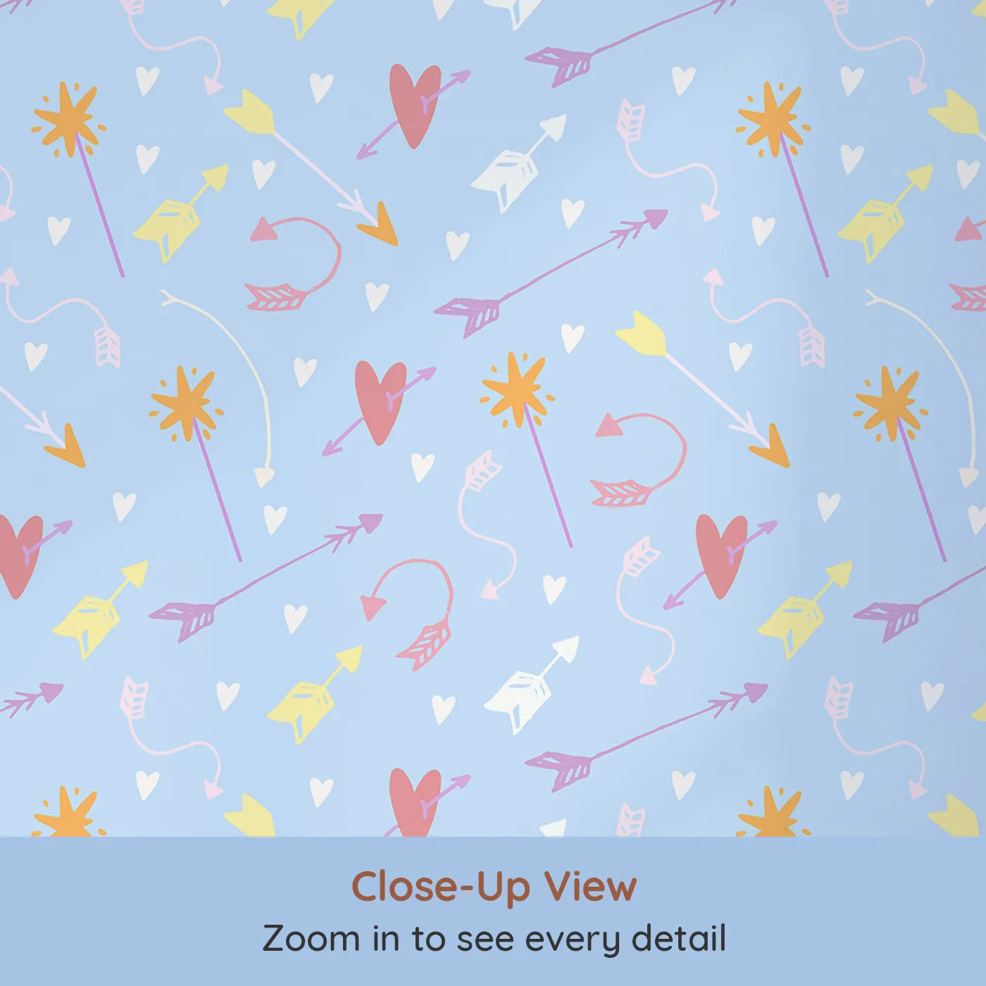 Close-up view of Whimsy Tots' Cupids Arrow Parade Wallpaper in Sky Blue (W3143D).Pastel hearts and arrows swirl across a playful blue sky.