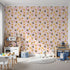 Front view of Whimsy Tots' Monkey Banana Jungle Wallpaper in Pink