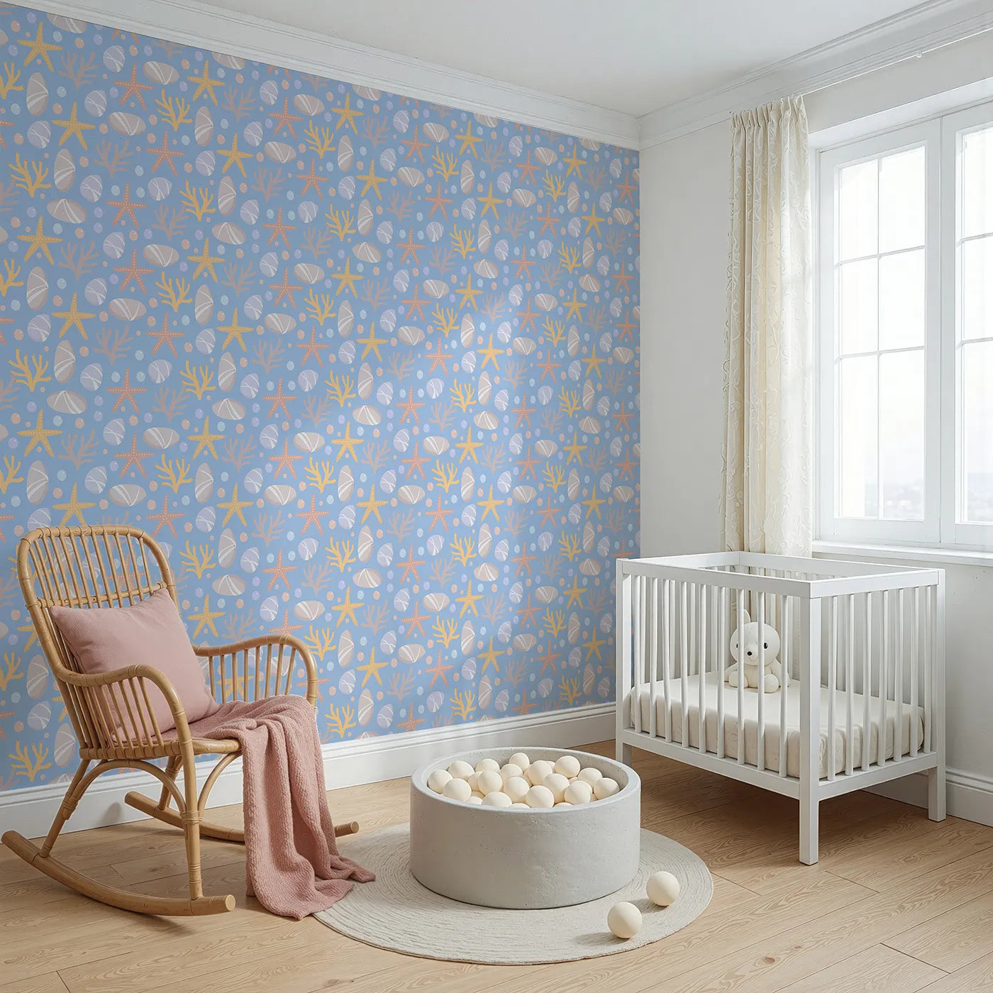 Angled view of Whimsy Tots' Pebble Shoreline Calm Wallpaper in Sky Blue (W3192B).Gentle stones, starfish, and coral float across a quiet seaside breeze.