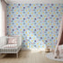 Front view of Whimsy Tots' Planet Pals Orbit Parade Wallpaper in Sky Blue