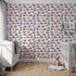 Front view of Whimsy Tots' Tiny Wheels Parade Wallpaper in Soft Pink