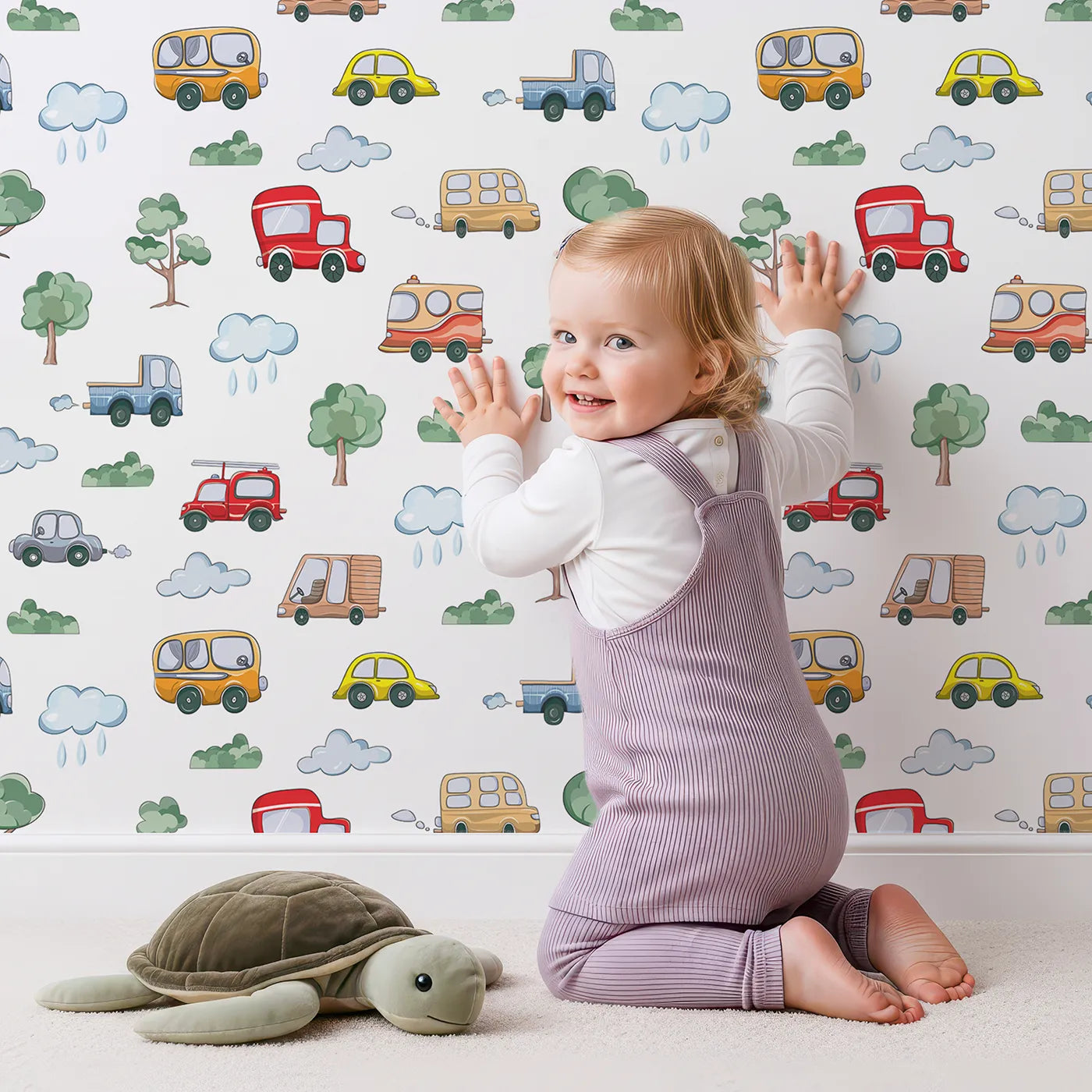 Lovely child standing in front of Whimsy Tots Bumper Buddies Forest Drive Wallpaper in White with car, tree, cloud, raindrop, bus in design.