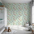 Front view of Whimsy Tots' Bumper Buddies Forest Drive Wallpaper in Mint Green