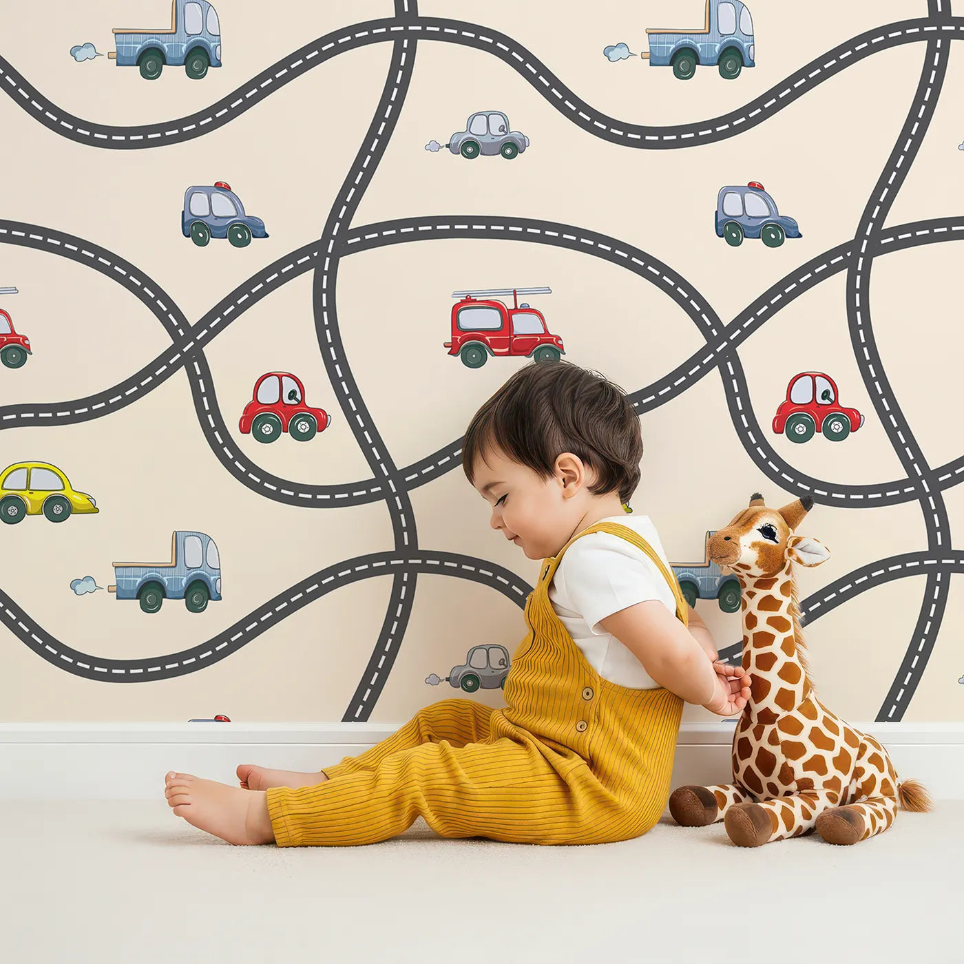 Lovely child standing in front of Whimsy Tots Bumper Buddies Road Maze Wallpaper in Cream with car, road, truck, taxi in design.