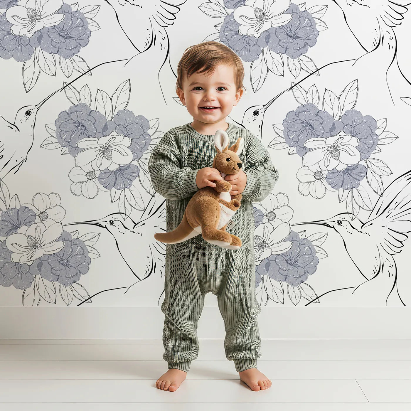 Lovely child standing in front of Whimsy Tots Hummingbird Garden Sketch Wallpaper in Ink Bloom with bird, hummingbird, flower, petal in design.