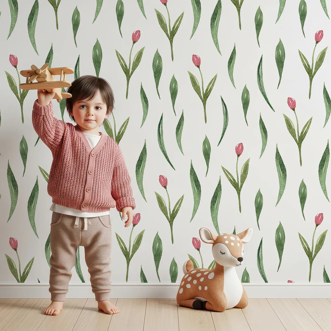 Lovely child standing in front of Whimsy Tots Tulip Meadow Dots Wallpaper in White with flower, leaf, tulip in design.