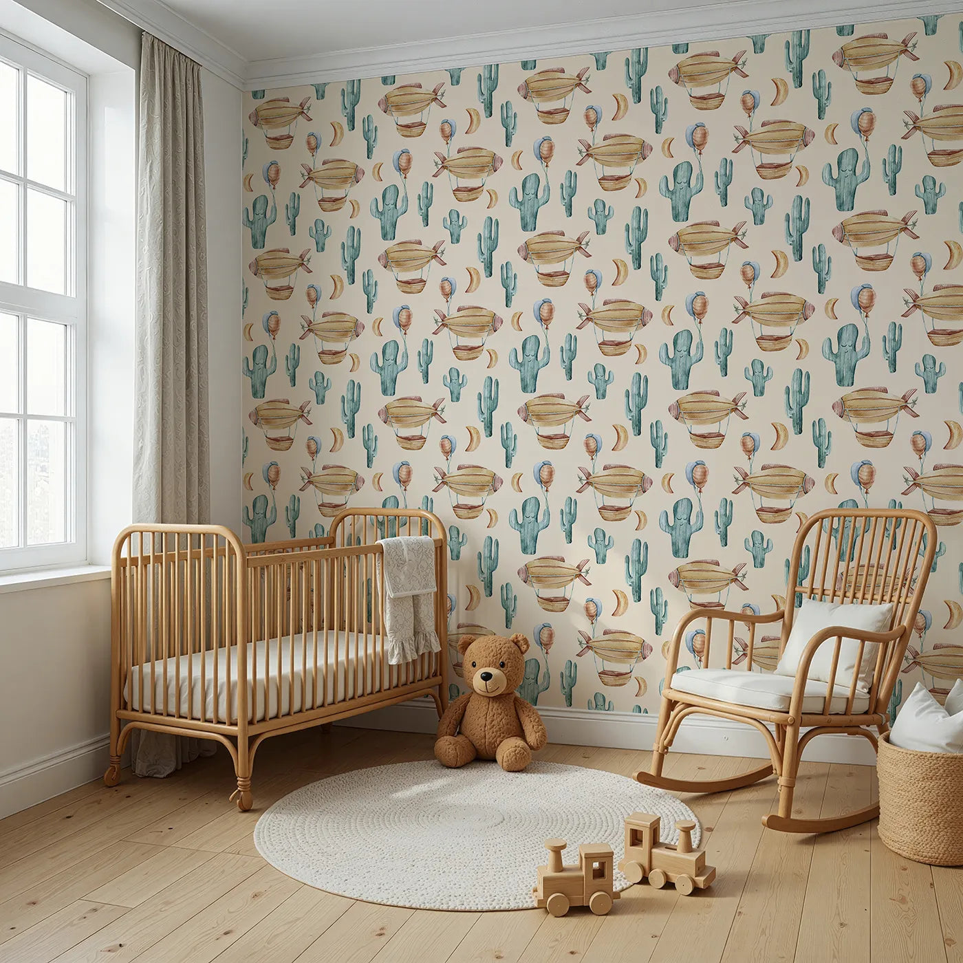 Angled view of Whimsy Tots' Desert Balloon Voyage Wallpaper in Cream (W3278C).Airships float through a cozy cream sky above smiling cacti and golden moons.
