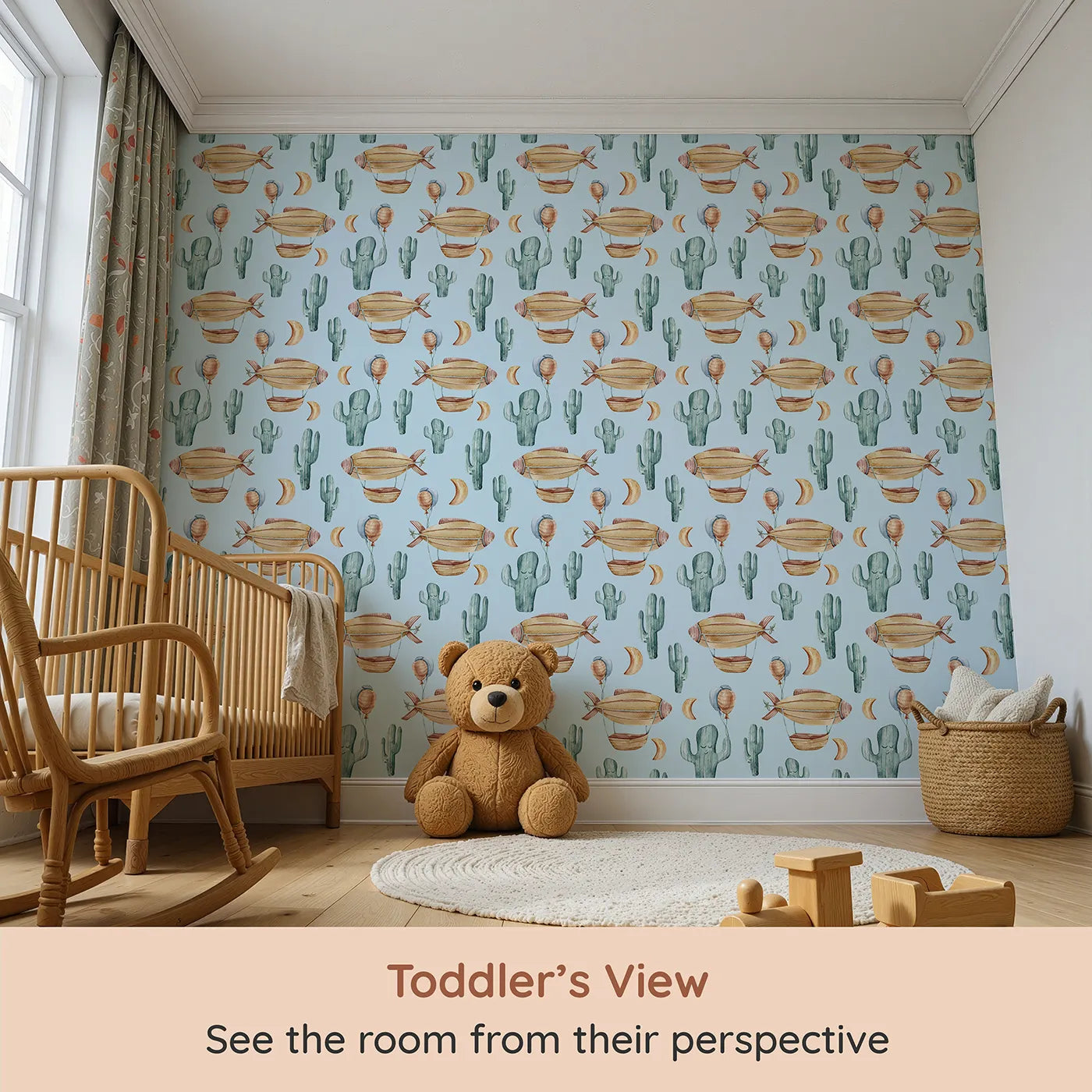 Whimsy Tots Desert Balloon Voyage Wallpaper in Blue (W3278E) from your child's view.Floating airships and gentle cacti drift through a watercolor desert sky.
