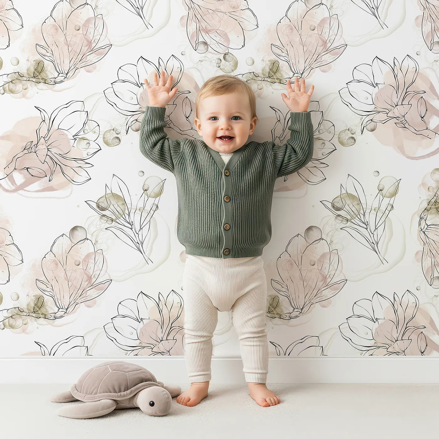 Lovely child standing in front of Whimsy Tots Blushing Magnolia Whirl Wallpaper with magnolia, flower, leaf, bubble in design.
