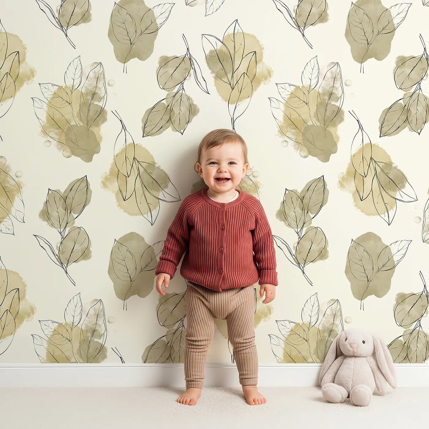 Lovely child standing in front of Whimsy Tots Whispering Leaf Sketch Wallpaper with leaf, branch in design.