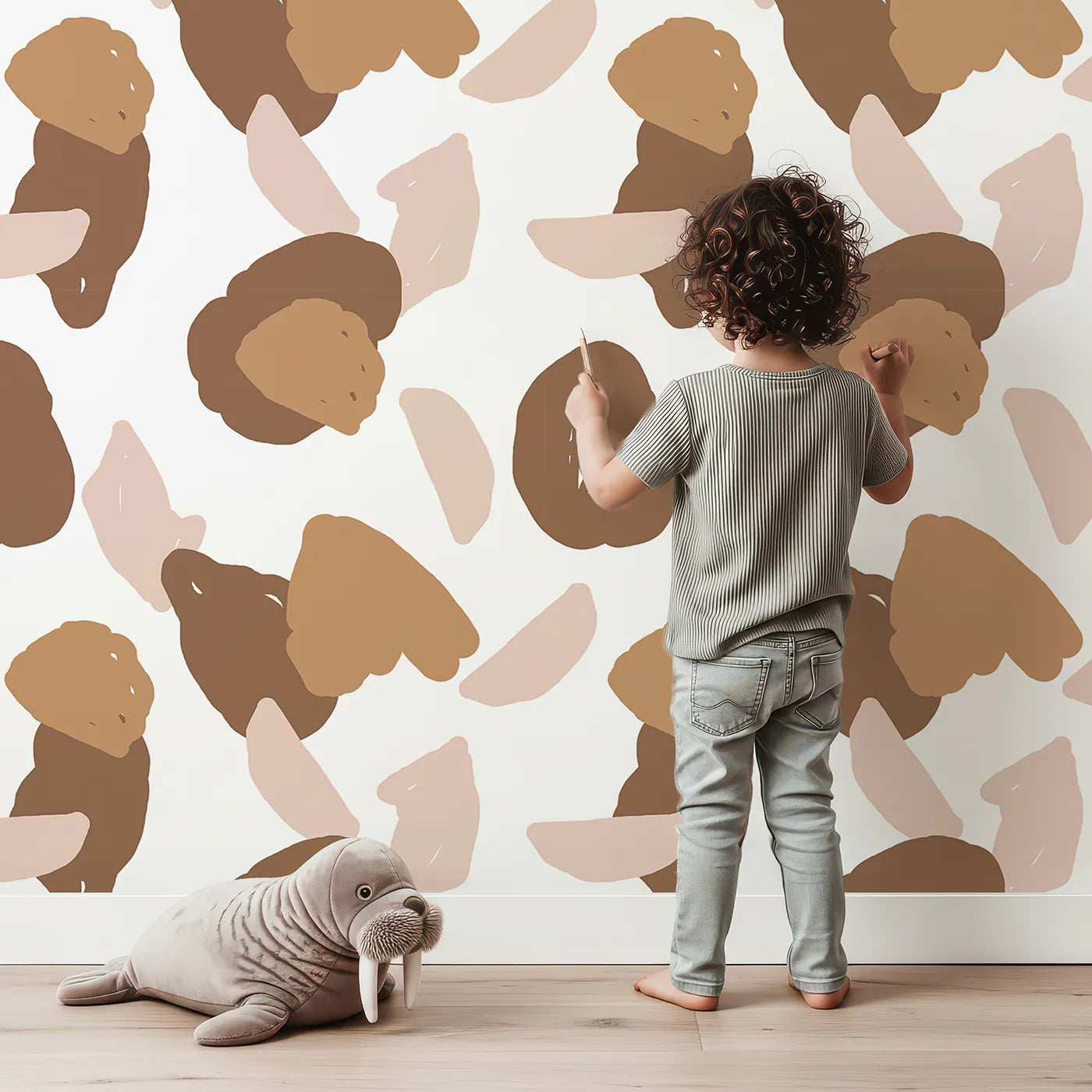 Lovely child standing in front of Whimsy Tots Desert Pebble Scatter Wallpaper with pebble, shape, blob, abstract in design.