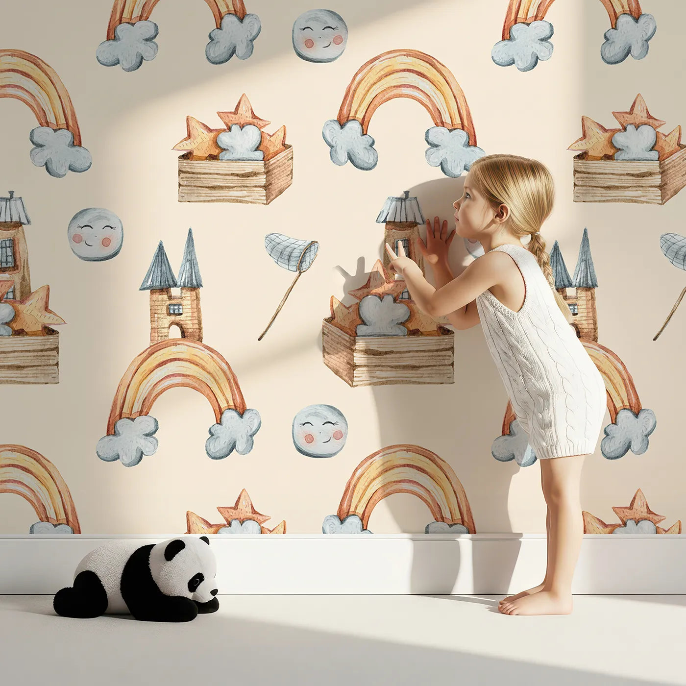 Lovely child standing in front of Whimsy Tots Rainbow Castle Dreams Wallpaper in Peach with castle, rainbow, moon, cloud, star, net in design.