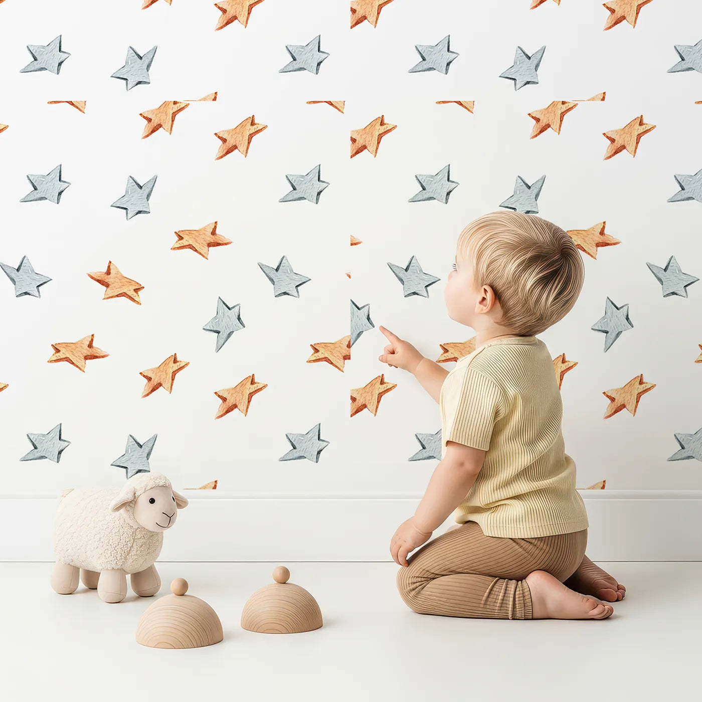 Lovely child standing in front of Whimsy Tots Wooden Star Sprinkle Wallpaper in White with star in design.