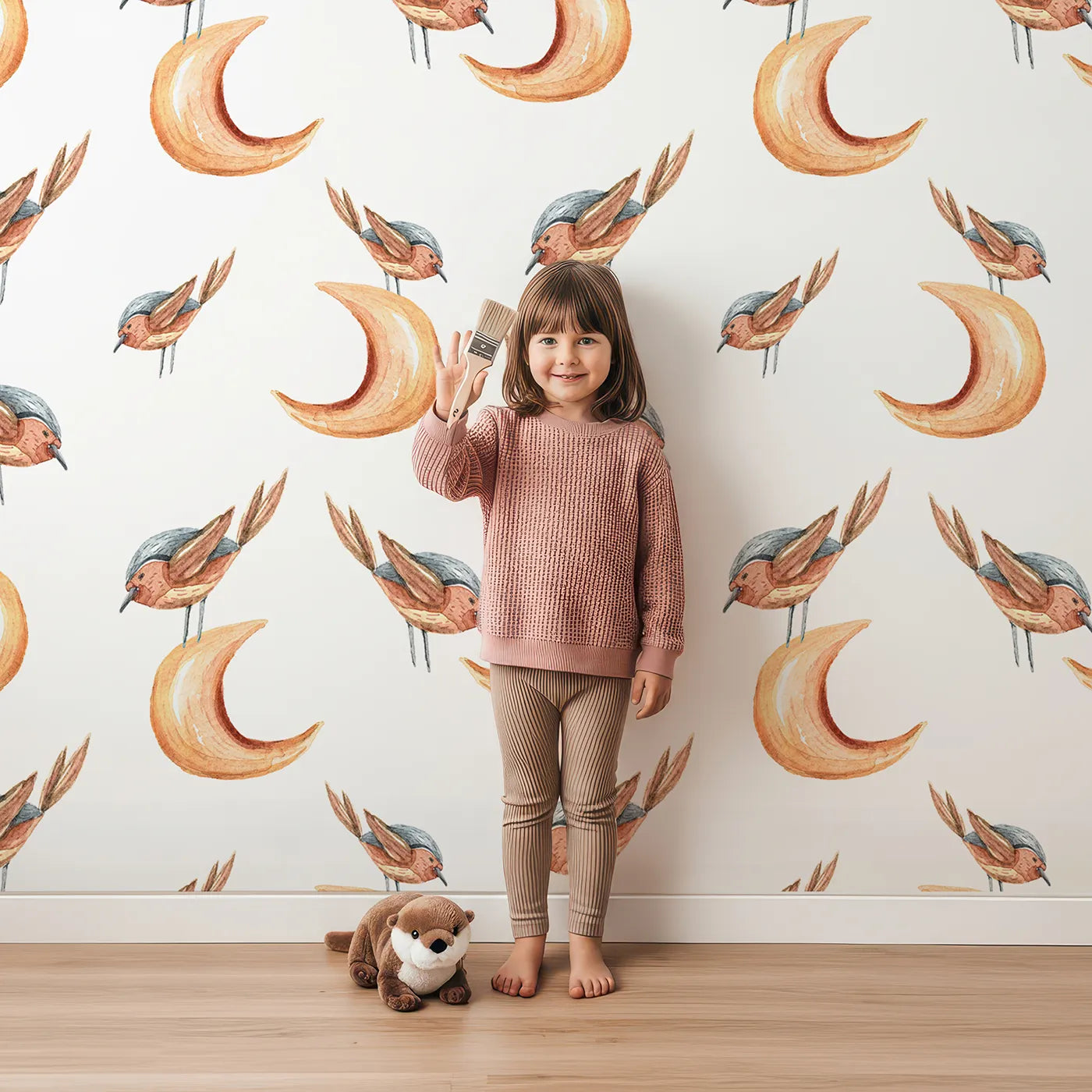 Lovely child standing in front of Whimsy Tots Moon Perch Birds Wallpaper in White with bird, moon in design.