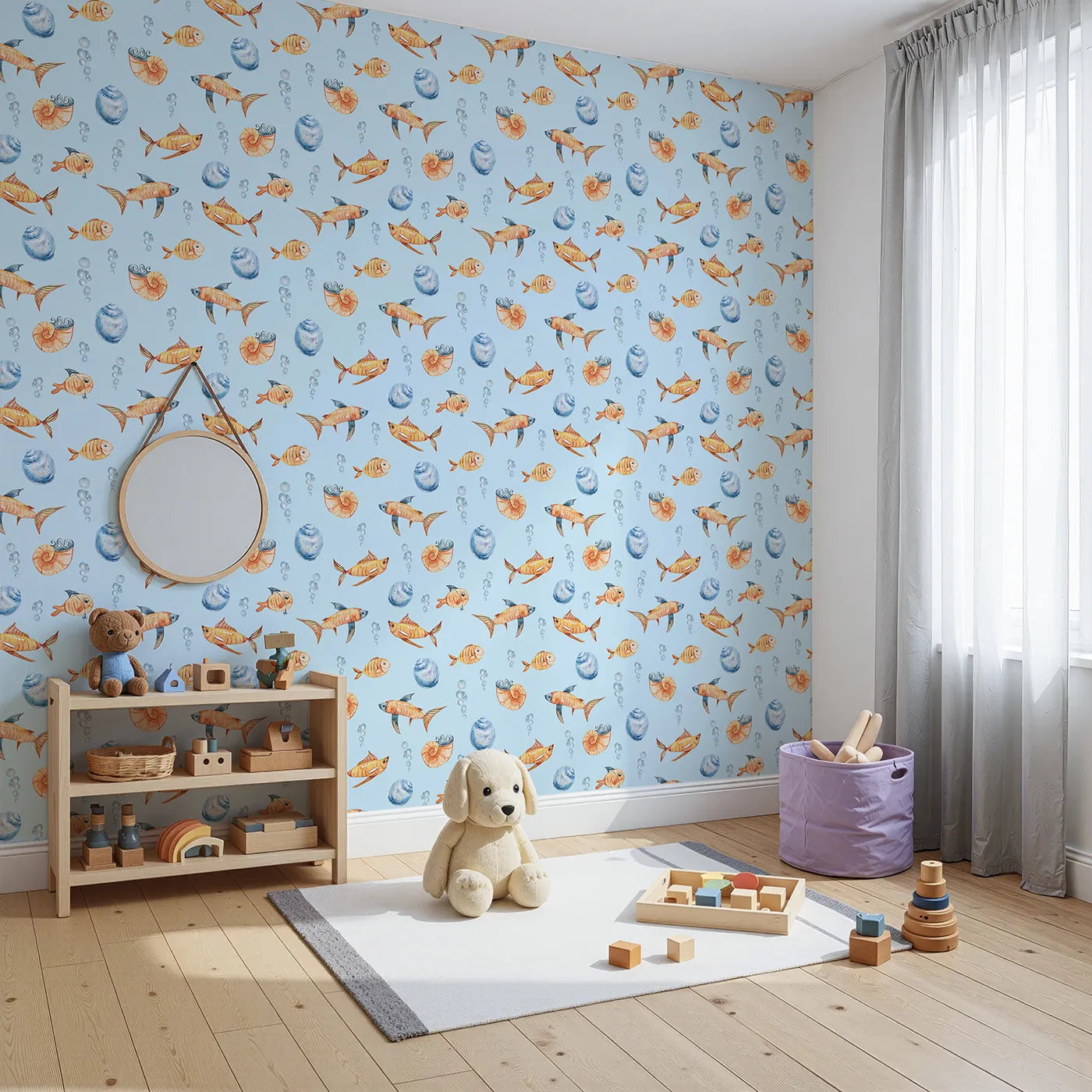 Angled view of Whimsy Tots' Undersea Bubble Friends Wallpaper in Blue (W3318E).Smiling orange fish swirl through a soft blue sea of shells and bubbles.