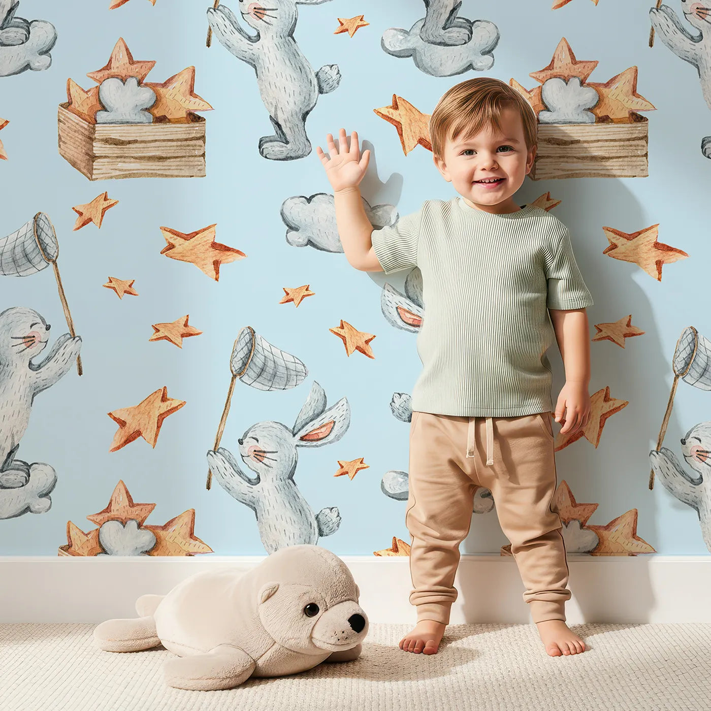 Lovely child standing in front of Whimsy Tots Star Catcher Bunnies Wallpaper in Blue with rabbit, star, cloud, net in design.