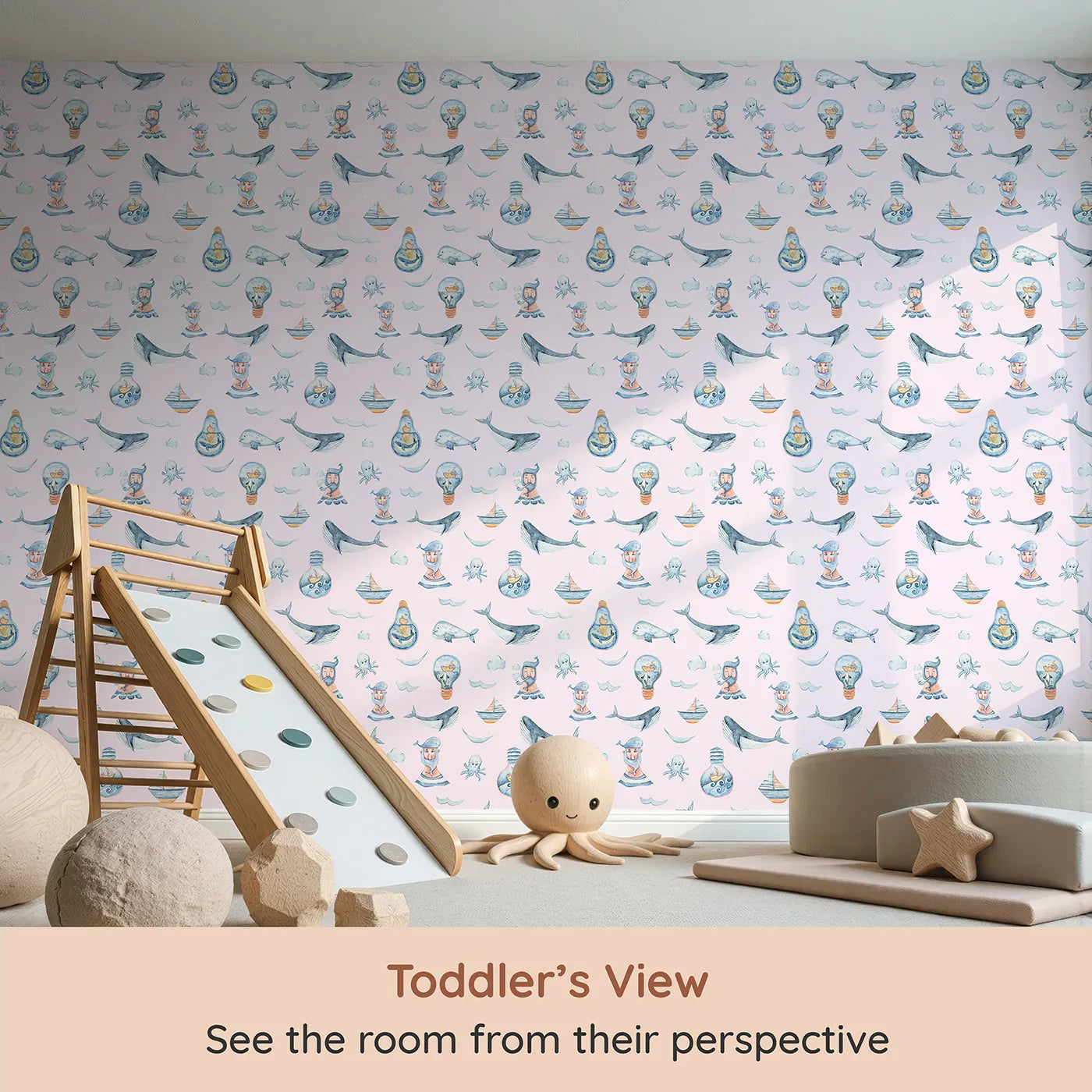 Whimsy Tots Maritime Whimsy Wallpaper in Blush Pink (W3326B) from your child's view.Smiling whales and quirky captains float on soft pink seas.