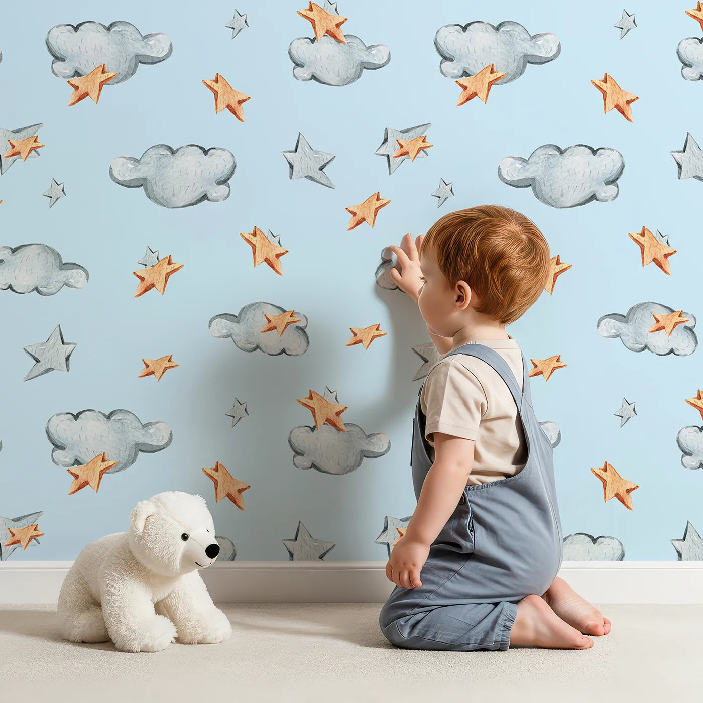 Lovely child standing in front of Whimsy Tots Cloudy Star Drift Wallpaper in Sky Blue with star, cloud in design.