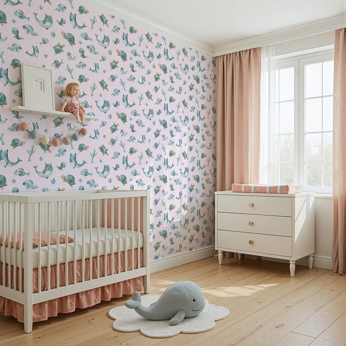Angled view of Whimsy Tots' Gentle Sea Friends Wallpaper in Pink (W3334B).Soft whales and turtles float peacefully across pastel tides.