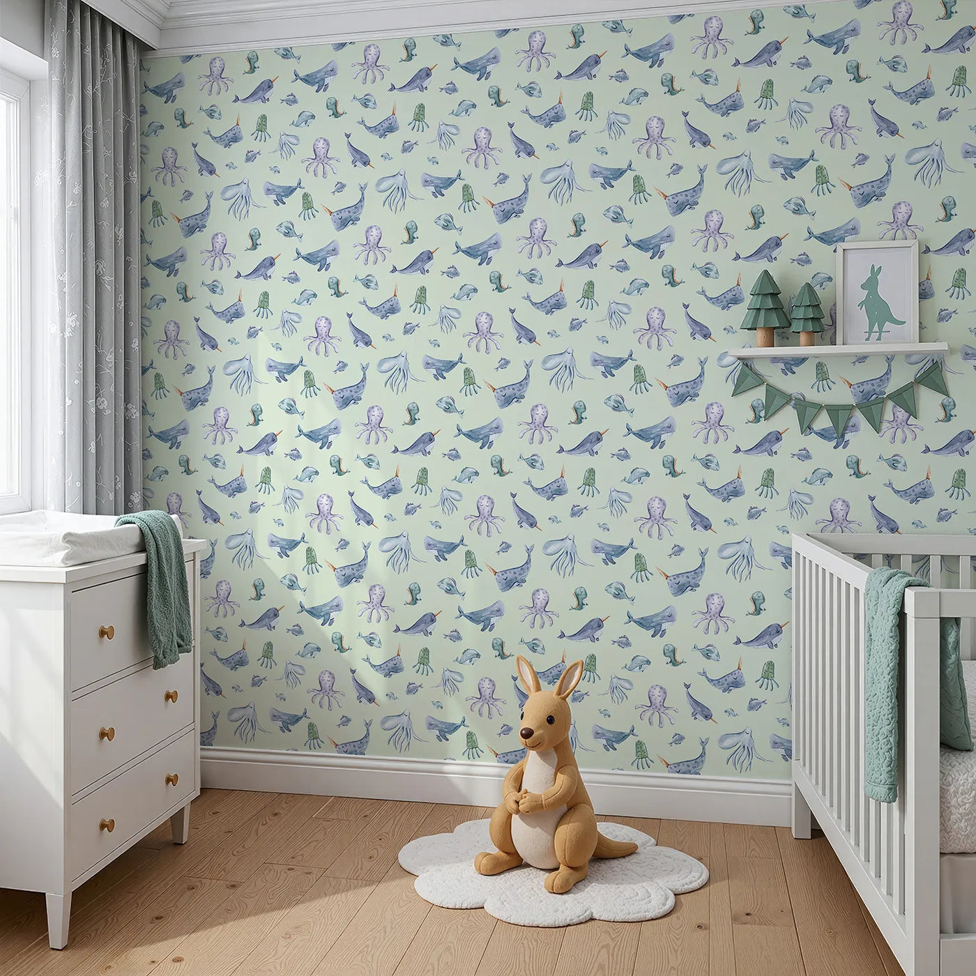 Angled view of Whimsy Tots' Gentle Ocean Parade Wallpaper in Mint Green (W3335D).Whales and jellyfish float peacefully across minty ocean skies.