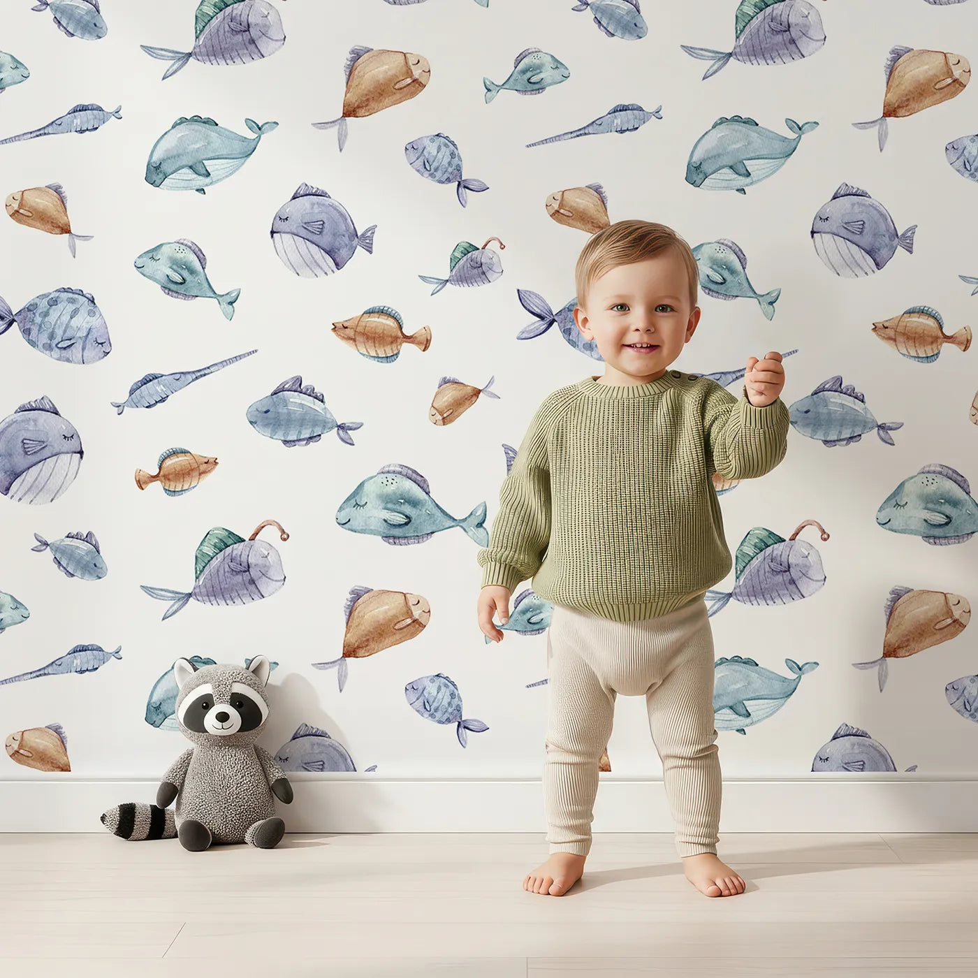 Lovely child standing in front of Whimsy Tots Dreamy Fish Parade Wallpaper in White with fish, fin, puffer, anglerfish, goby in design.