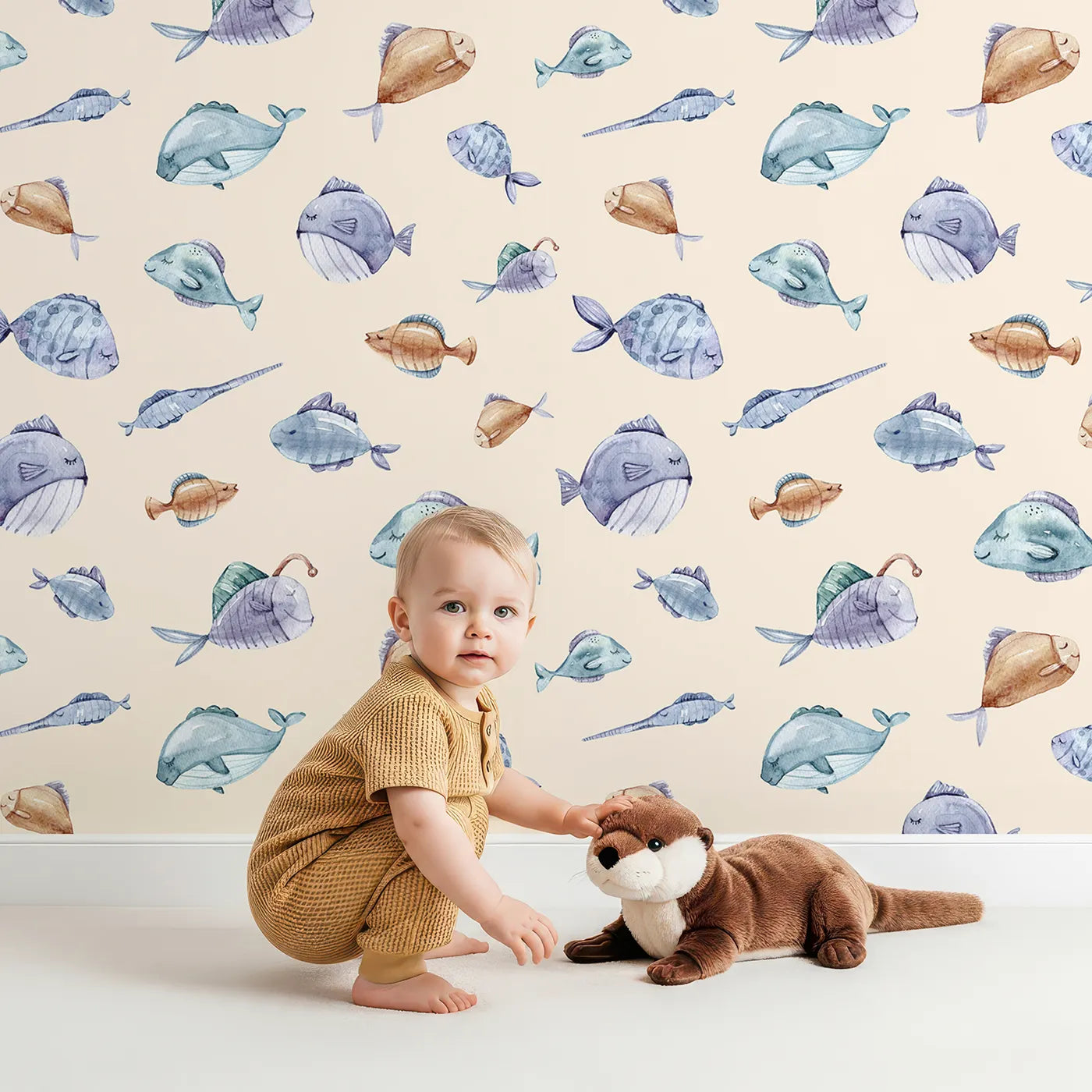 Lovely child standing in front of Whimsy Tots Dreamy Fish Parade Wallpaper in Peach with fish, fin, puffer, anglerfish, goby in design.