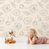Lovely child standing in front of Whimsy Tots Line Art Bloom Wallpaper in Cream with flower, blossom, lineart, leaf in design.