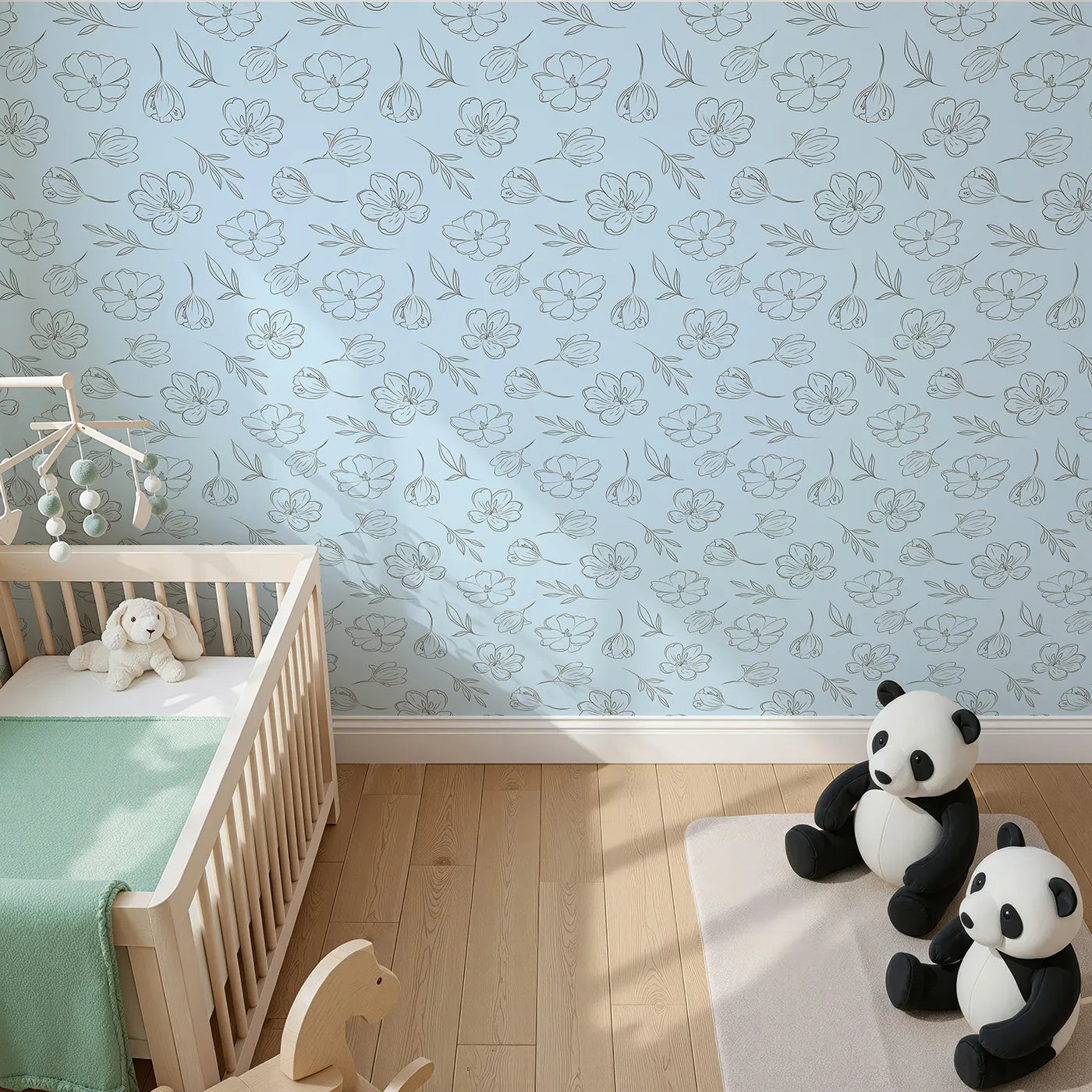 Top-Down view of Whimsy Tots' Line Art Bloom Wallpaper in Blue (W3340E).Simple black florals dance gently across soft blue skies.