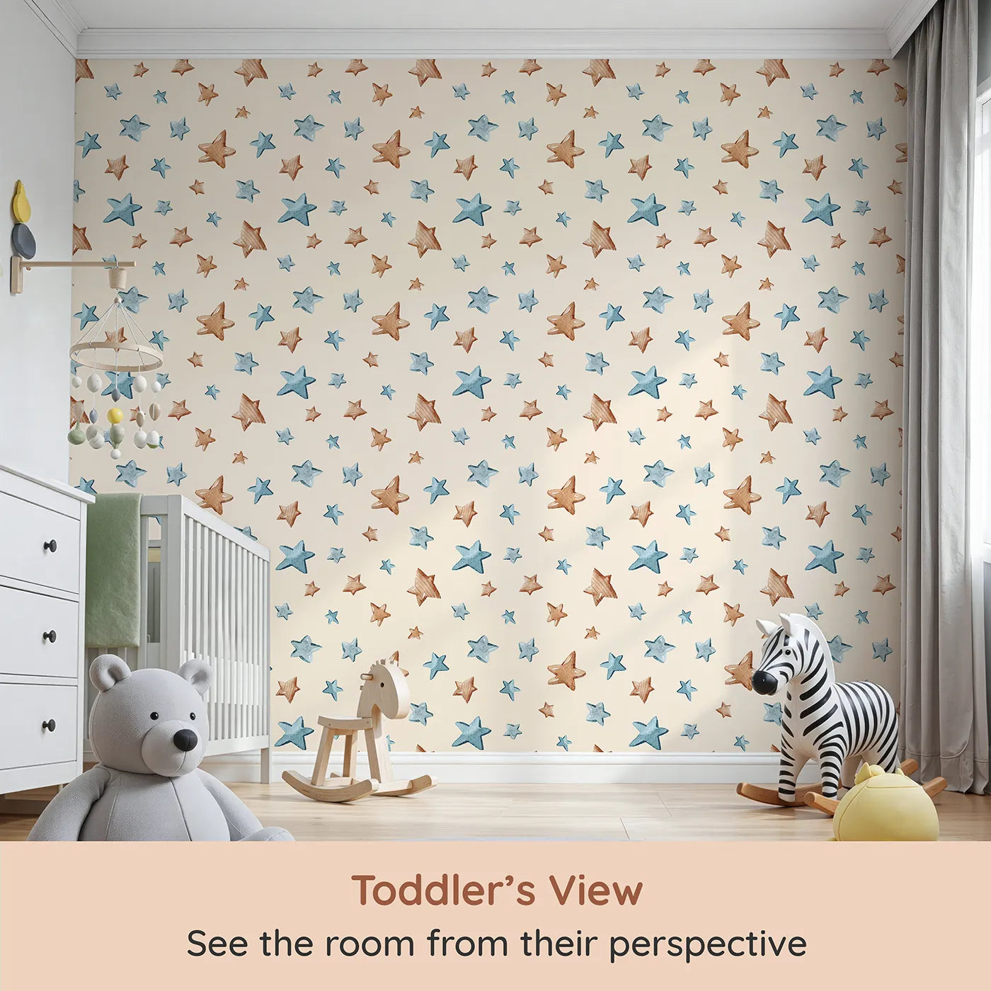 Whimsy Tots Starry Drift Wallpaper in Cream (W3341C) from your child's view.Blue and brown watercolor stars float across a soft cream backdrop.