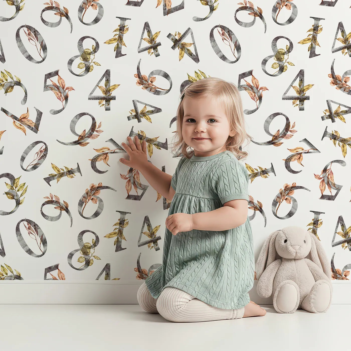 Lovely child standing in front of Whimsy Tots Botanical Numbers Garden in White with number, leaf, branch, stem in design.