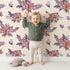 Lovely child standing in front of Whimsy Tots Berry Meadow Whispers in Sand with flower, leaf, petal, sprig in design.