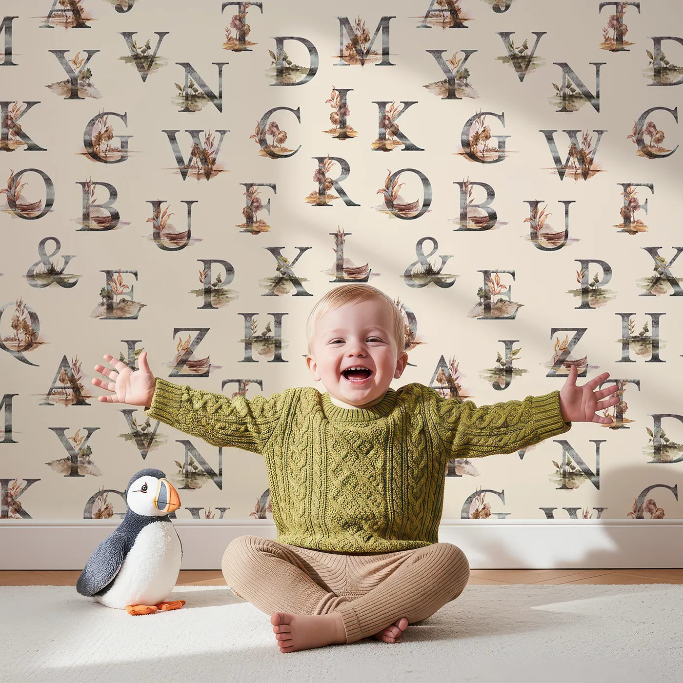 Lovely child standing in front of Whimsy Tots Rustic Alphabet Adventure in Oat with letter, alphabet, tree, boat, plant in design.
