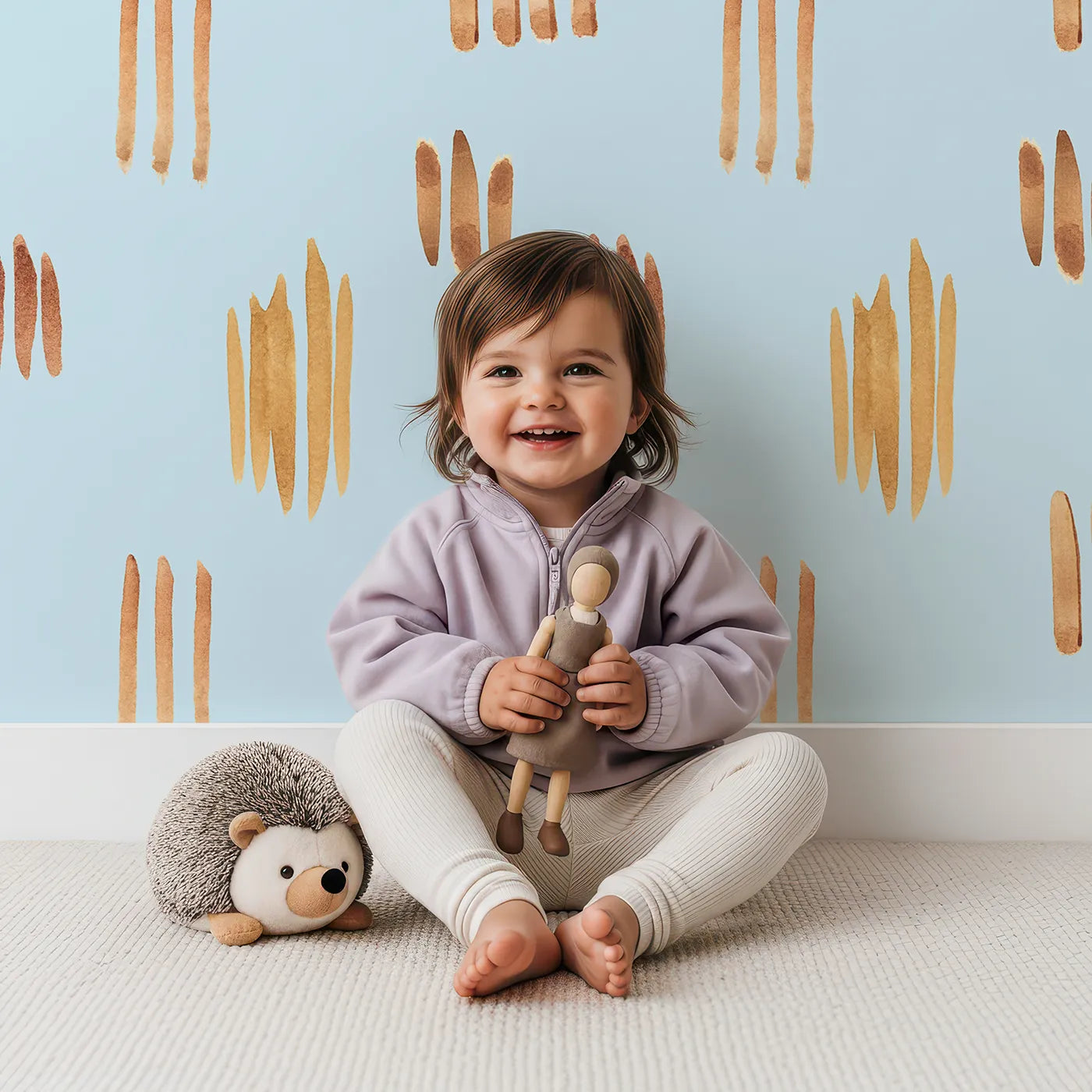 Lovely child standing in front of Whimsy Tots Painted Simplicity Wallpaper in Sky with line, brushstroke in design.