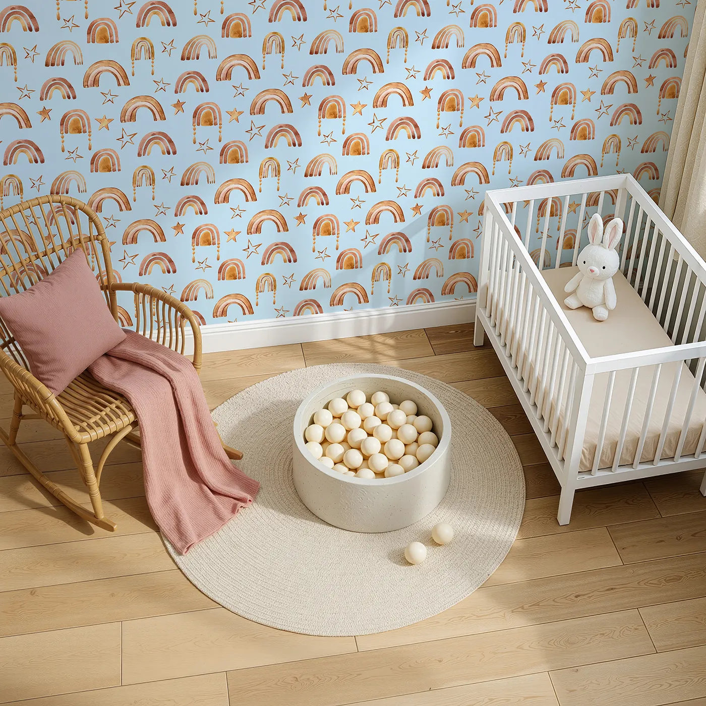 Top-Down view of Whimsy Tots' Golden Boho Rainbows Wallpaper in Blue (W3387E).Warm rainbows and soft golden stars drift across a baby blue sky.