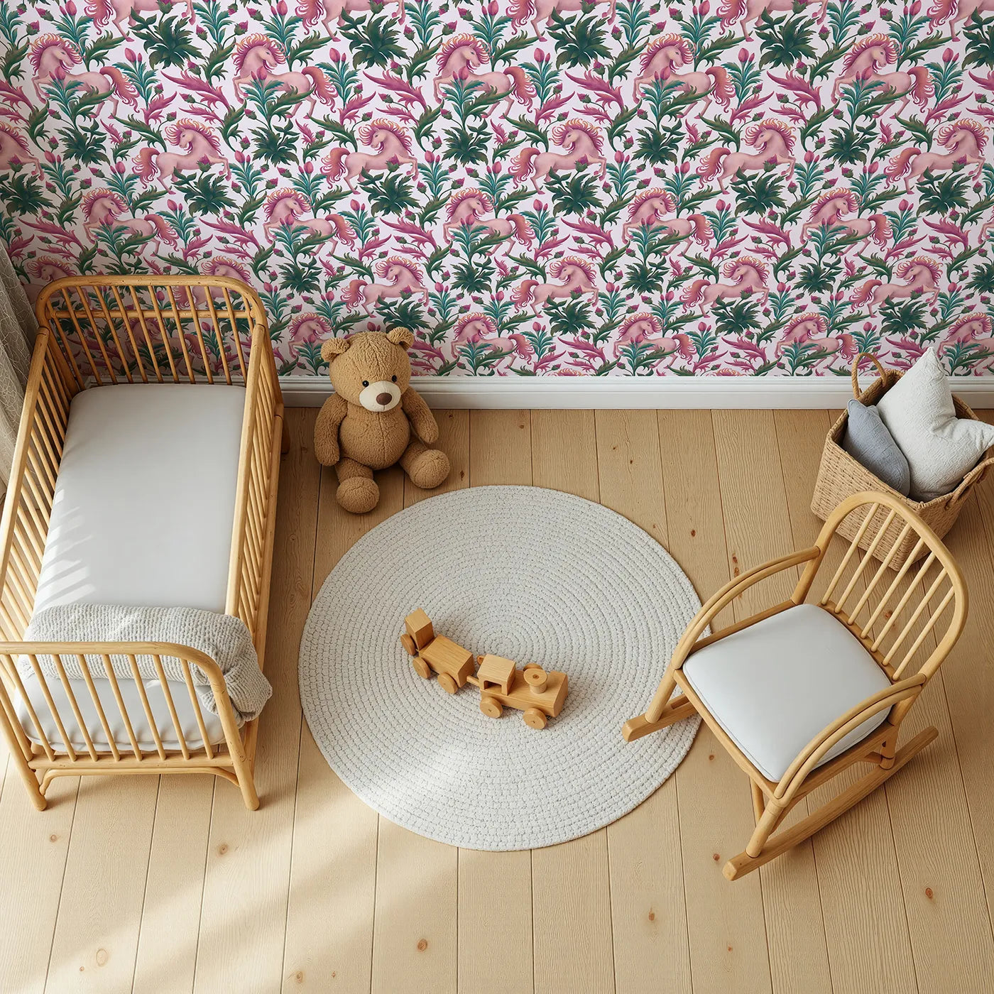 Top-Down view of Whimsy Tots' Enchanted Meadow Prance Wallpaper in Blush Pink (W3389B).Pink skies and prancing unicorns turn every wall into a floral fantasy.