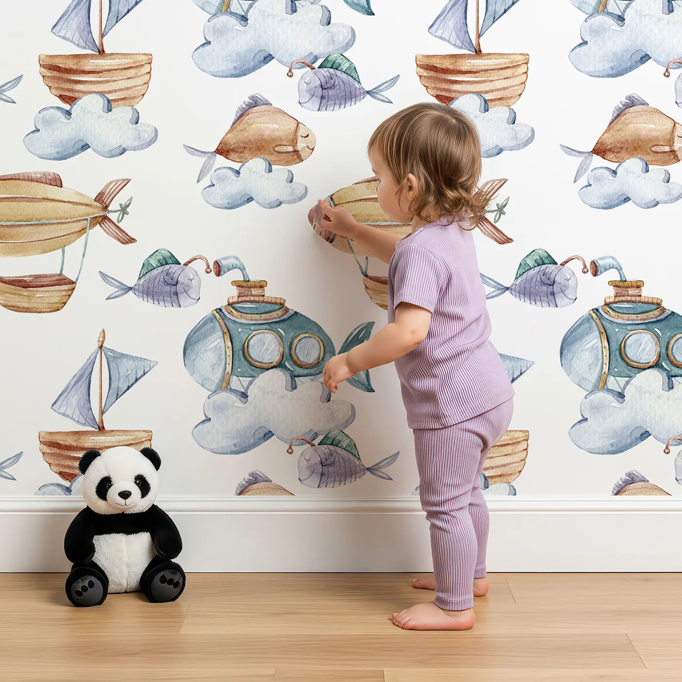 Lovely child standing in front of Whimsy Tots Skybound Explorers Wallpaper in White with submarine, boat, fish, cloud, airship in design.