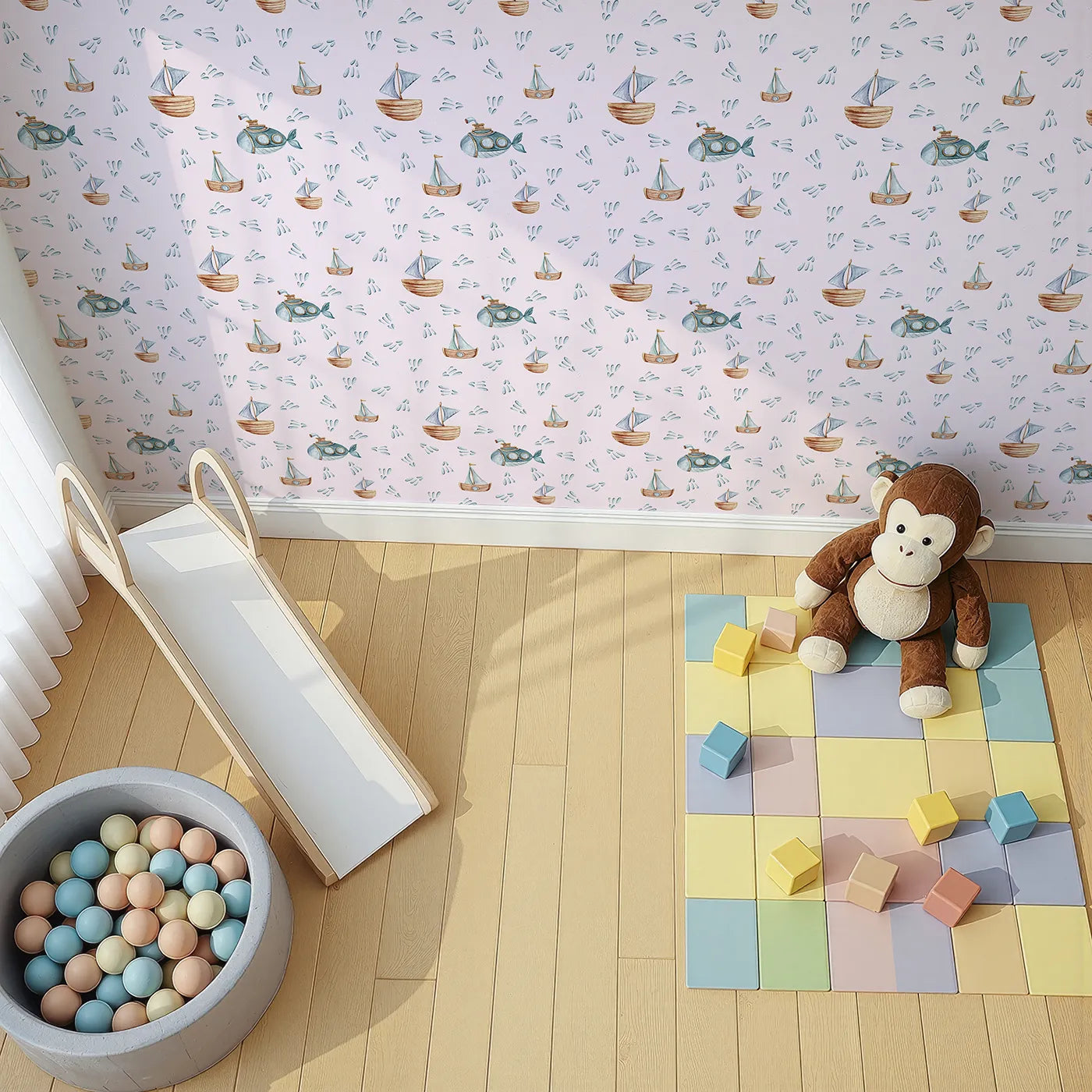 Top-Down view of Whimsy Tots' Seaside Vessel Parade Wallpaper in Pink (W3399B).Submarines and sailboats float gently through a pastel-pink ocean sky.