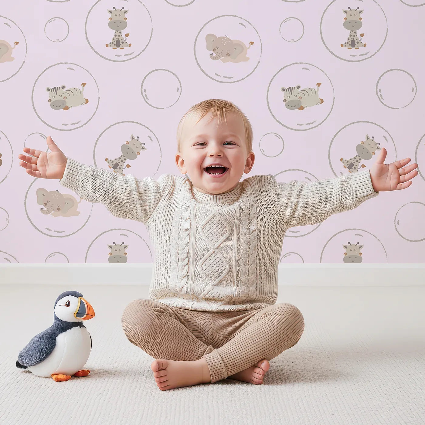 Lovely child standing in front of Whimsy Tots Safari Nap Bubbles Wallpaper in Lilac Lavender with elephant, zebra, lion, giraffe, hippo, bubble, circle in design.