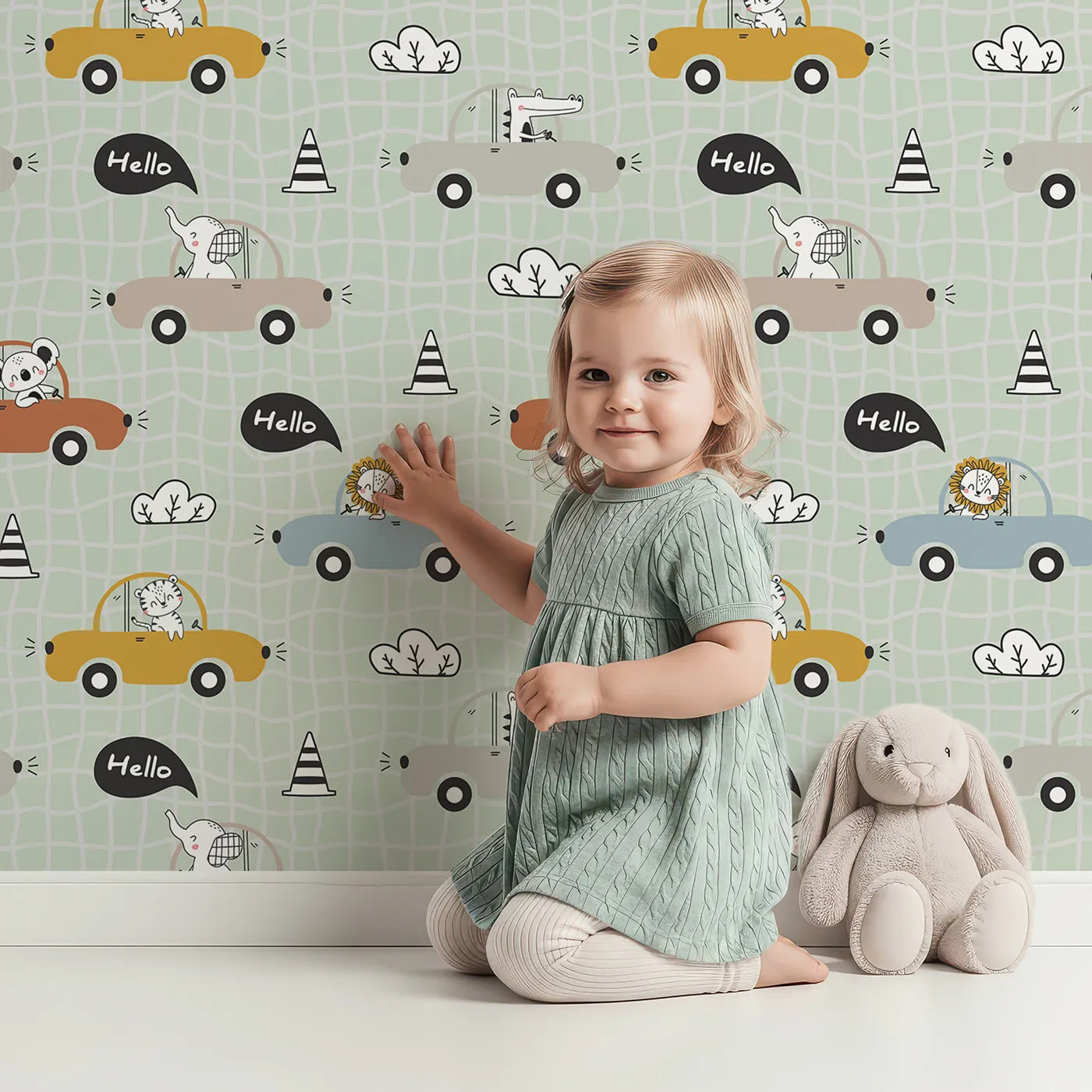 Lovely child standing in front of Whimsy Tots Animal Drivers Parade Wallpaper in Green Grid with car, lion, elephant, koala, tiger, crocodile, traffic cone, cloud in design.